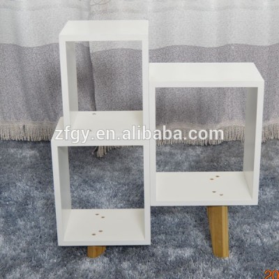 White frame bookshelf show irregular grid more wooden squares